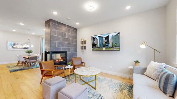 Living Room. Three-sided fireplace shared between the Kitchen and Dining Room.