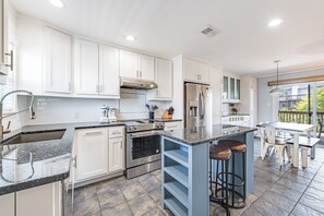 interior - Kitchen and island with seating for two