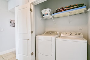 Full size washer and dryer in the entry way hall.