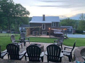 Backyard with fire pit, pool and hot tub