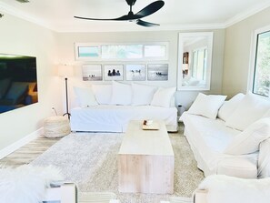 Our serene living room features oversized sofas, the perfect place to nap