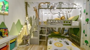 Safari themed, fun and comfortable kids room with a double bunk bed. 