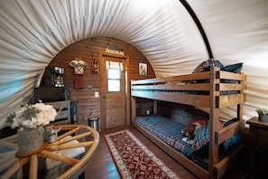 A couple guests can enjoy the bunk beds in the climate controlled wagon.