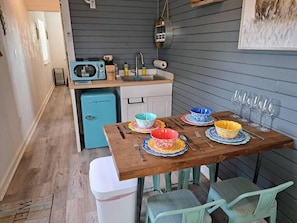 Dining area for four and kitchenette.