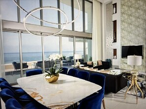 Living Room Glass doors open to let the sun and beach air into your Villa.