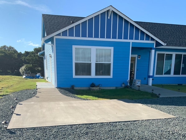 Parking and sidewalk to the guest door