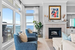Cozy up in style – living room with fireplace and smart tv for your ultimate relaxation.