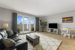 Living Area with Ocean Views, Flat Screen TV, Sleeper Sofa and Private Balcony Access