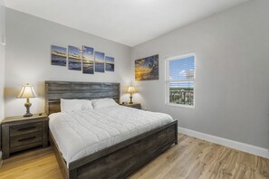 Primary Bedroom with King Size Bed, Flat Screen TV and Ensuite Bathroom