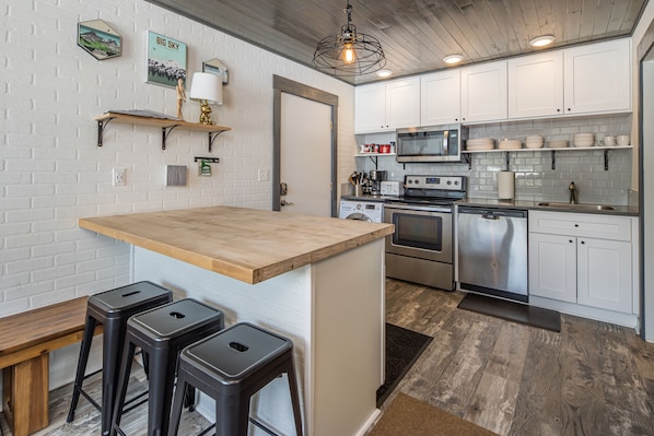 The homes entrance opens into the cozy Kitchen area