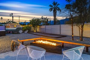 Palm Springs' nights made perfect with fire pit & hot tub at our rental.