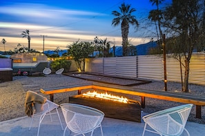 Palm Springs' nights made perfect with fire pit & hot tub at our rental.