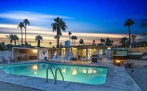 Palm Springs vacay rental: pool, hot tub, fire pit, trailer, dining & BBQ.