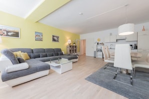 Overview of Arbio apartment with the cozy couch waiting for your visit in Vienna.