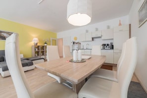 Dinning table allows 4 people to have a lovely meal together.