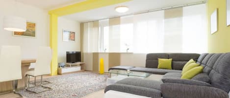 Modern design apartment to welcome our Arbio guests with yellow bright color