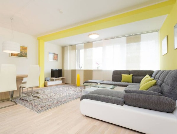 Modern design apartment to welcome our Arbio guests with yellow bright color