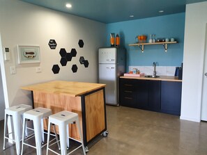 Kitchen area, bench top oven with burners included.
