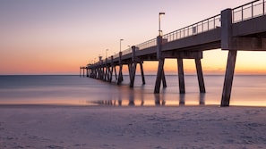 Stroll along the Island Fishing Pier and enjoy breathtaking sunset views over the water.