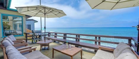 Enjoy your private outdoor seating area overlooking the ocean.