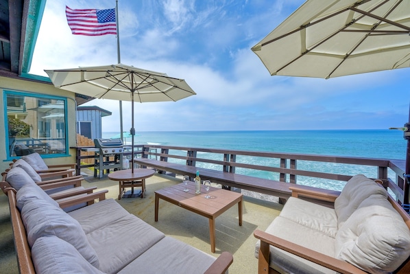 Enjoy your private outdoor seating area overlooking the ocean.