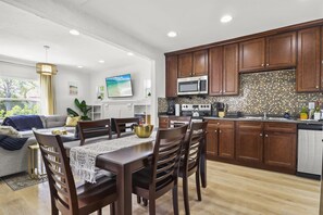 View of the dining area, kitchen and living room