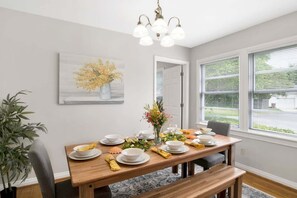 Dining room with large farm table. Seating for 8!