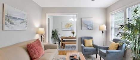 Living room with view into dining room