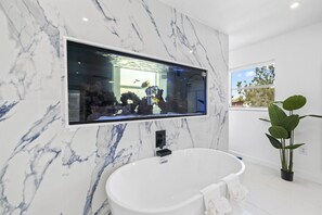 Master bathroom with double wall In shower and soaking tub 