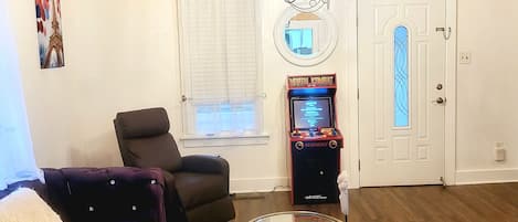 Living room 60'' Tv, Recliner, Arcade Game, Electric Fire Place. 