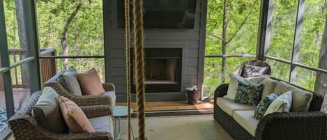 The screened in porch is a guest favorite. We love the outdoor fireplace.     