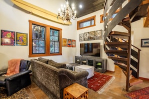 The living room original 60,s rock art posters, and a custom staircase.