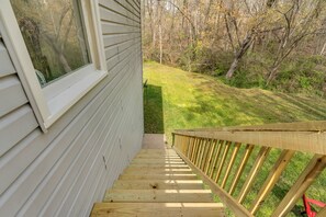 A stairway that leads to the entrance of the house