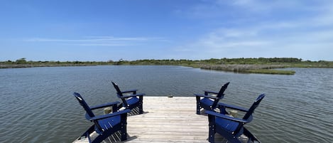 Our private dock over the sound has four Adirondack chairs. 