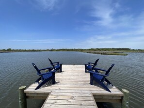 Our private dock over the sound has four Adirondack chairs. 