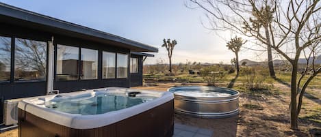 Hot tub and pool with desert views