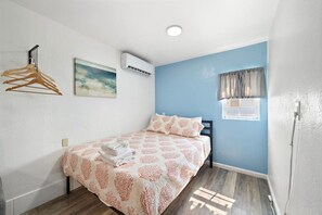 This bedroom has a queen bed