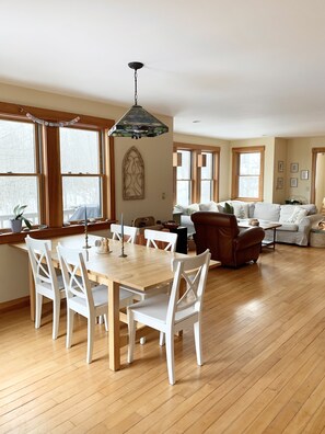 View from kitchen into open dining and living room space