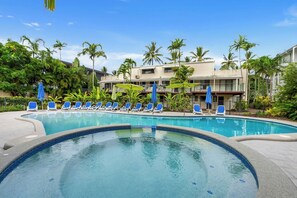 Pick a lounge chair and relax by the apartment's shared outdoor pool—with a spa to also enjoy.