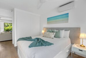 Rest easy in the chic bedroom with a queen bed and split-system cooling. A wardrobe provides ample space to hang and store your belongings.