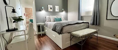 Comfy queen bed with extra linens and storage underneath bed