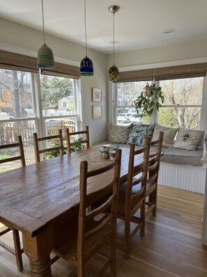 sunny dining area overlooking the backyard