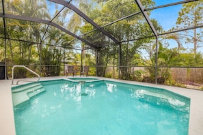 Private swimming pool with a hot tub