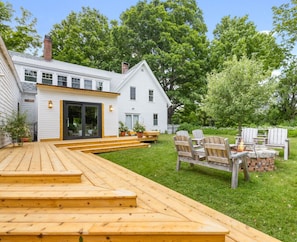 Large yards all around the house for kickball or a game of bocci ball. Lilacs and beautiful perennials surround the house. The backyard is fenced in to keep your dogs safe. Roast marshmallows by our fire pit.