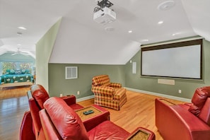 Inviting media room with a projector-screen ideal for unwinding.