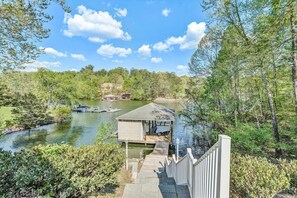 Beautifully tiered garden with a moderate slope leading to the sparkling lake.