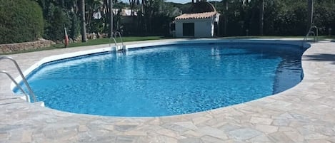 PRIVATE WALLED POOL WITH KIDS PADDLE POOL, GRASSED AREA WITH SUN SHADES AND BEDS