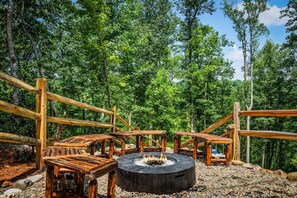 (Propane) Firepit overlooking the private backyard.