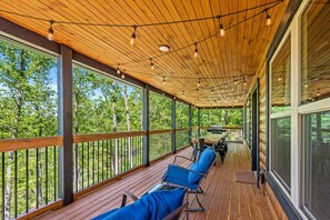 The outside deck area overlooks the quiet, wooded back yard.