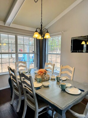 Dining room table with leaf to be able to accommodate more people around it.